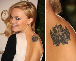 The actress loves the tattoo. Her upper back tattoo is inspired by her Buddhist upbringing while her wrist tattoo 